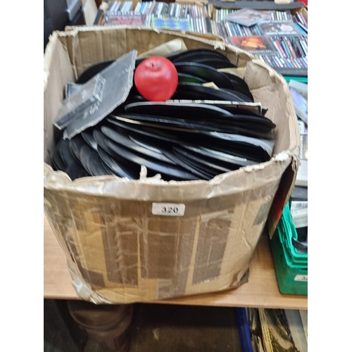 320 - A large collection of vintage 7 Inch records. Unchecked