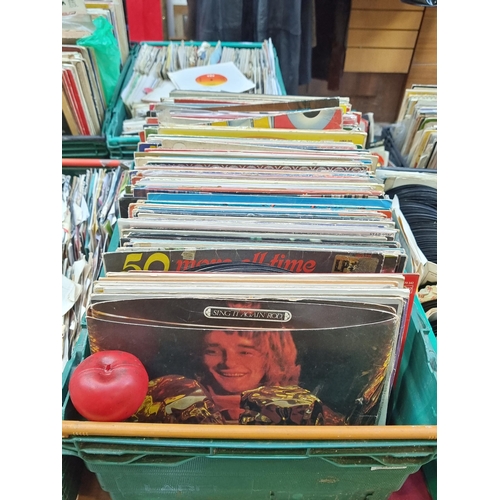 329 - A large and impressive collection of vinyl records from various different artists and genres. Unchec... 