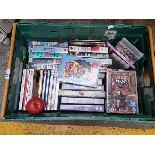 372 - A large crate of DVD's and video cassette.