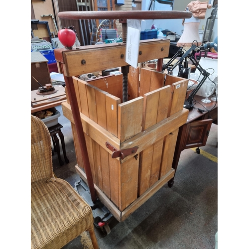 390 - Star Lot : A brilliant large capacity apple / cider press. Solid pine and cast iron turn wheel const... 