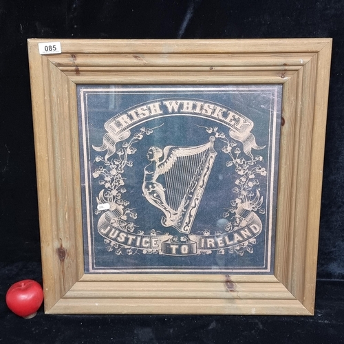 85 - A vintage print of a 'Justice to Ireland' Irish Whiskey advertising poster. Housed in a solid pine f... 