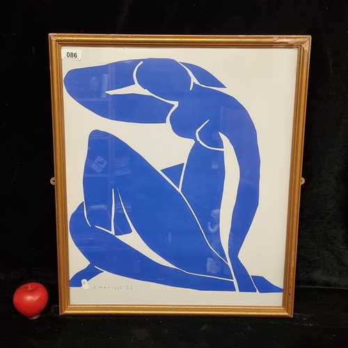 86 - A large graphic print of 'Blue Nude II' by Henry Matisse 1952. Housed in a gilt frame behind glass.