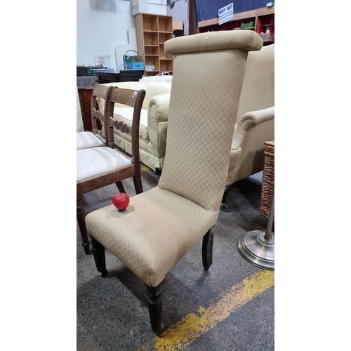 404 - A charming Victorian prayer chair with original castors, fluted front legs and cream upholstery.