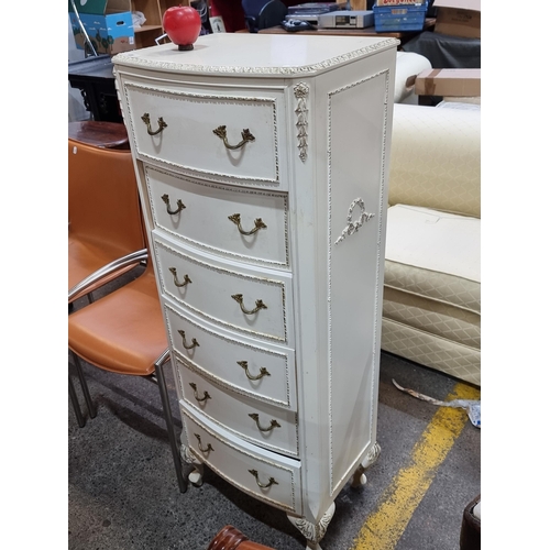 406 - A highly ornate French style chest of drawers with bow front and 6 drawers. Boasting gilt detailing ... 