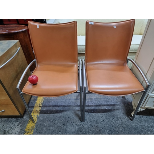 407 - Star Lot: A very stylish pair of designer Girsberger office chairs with genuine leather seats in a t... 