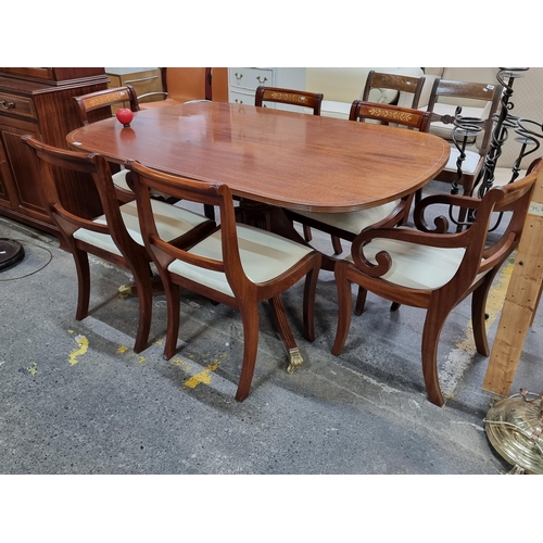 419 - Star Lot : A fabulous Regency style dining suite comprising of an elegant table with turned and reed... 