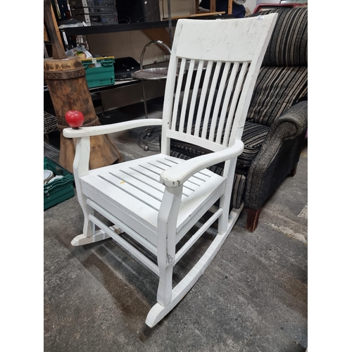 437 - An attractive well crafted off white rocking chair.