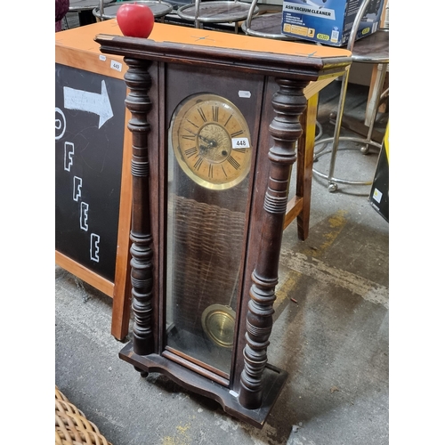 448 - A beautiful Edwardian mahogany pendulum wall clock with turned wood detail and brass dial featuring ... 