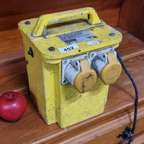 452 - A 230 to 110V site transformer with three pin plug.