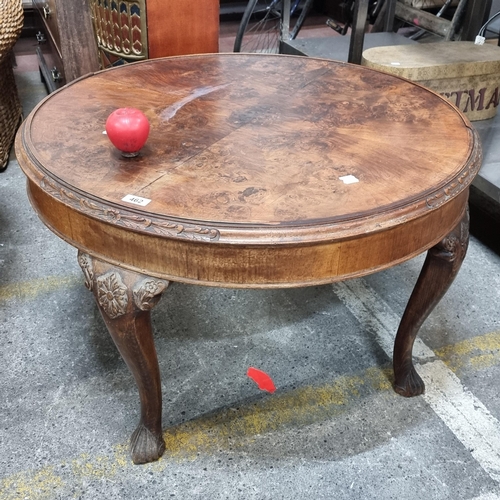 462 - A vintage burr walnut drum coffee table with ornate carved cabriole legs and foliate detail. approx ... 