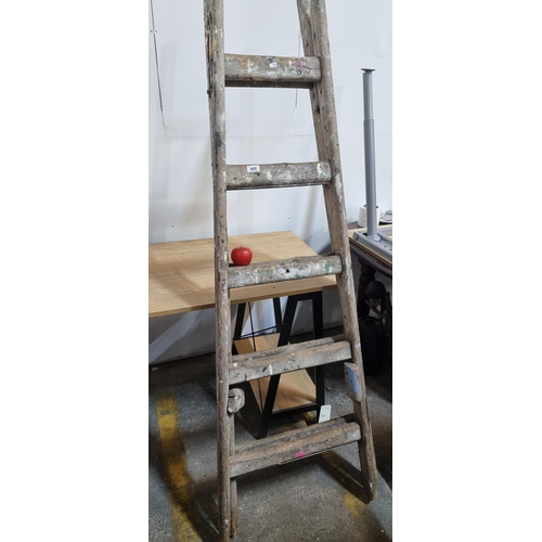 468 - A vintage wooden A frame ladder with five rungs.