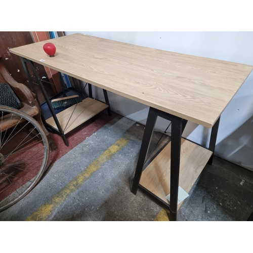 469 - A very stylish contemporary desk with industrial style metal supports to base. Features two open she... 