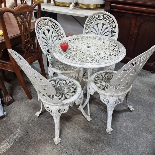 482 - Star Lot : A gorgeous antique cast iron five piece garden patio set consisting of four chairs and a ... 