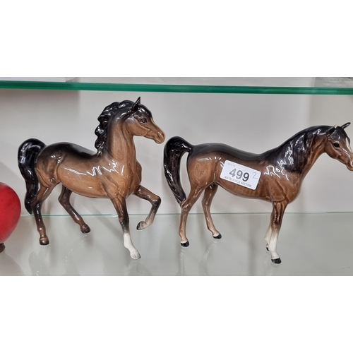 499 - A pair of elegant Beswick porcelain horses. SD to one ear of one horse.