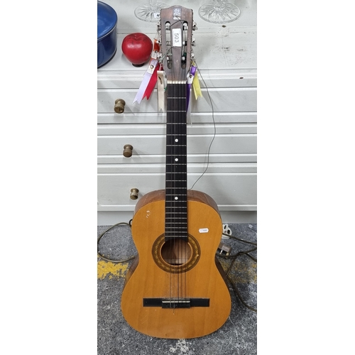 503 - A handsome children's guitar with mother of pearl effect tuners.