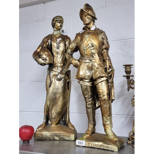 533 - A pair of tall gilt plaster statues depicting a young Roman soldier and Spanish conqueror. Very smal... 