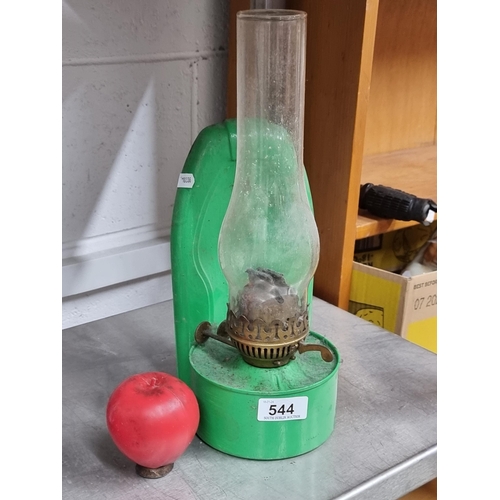 544 - A vintage Duplex oil lamp with a glass chimney, brass fittings and a vibrant green frame.