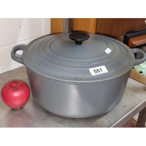 551 - A Le Creuset cast iron 6.7L dutch oven with two handles and lid. In a modern grey finish. In very cl... 