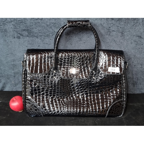 552 - A stylish and large Jasper Conran at Tripp handbag boasting an embossed croc effect in a glossy blac... 