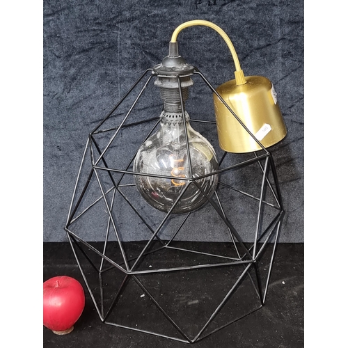 571 - A stylish pendant chandelier with a geometric metal cage shade and an oversized Eddison lightbulb wi... 