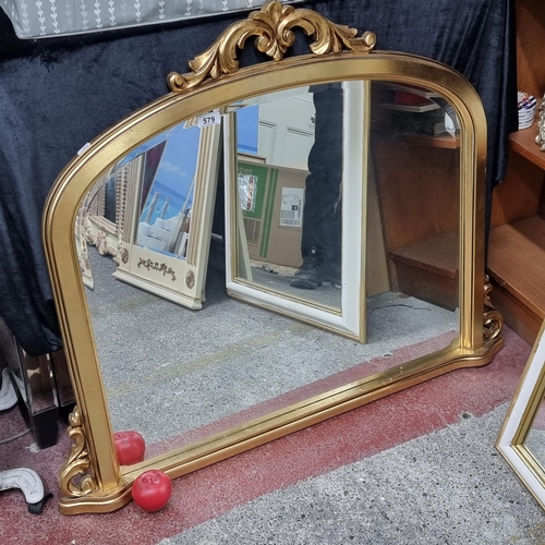 579 - Star lot : A stunning and heavy gilt framed over mantel mirror with beveled glass. H84cm x W105cm