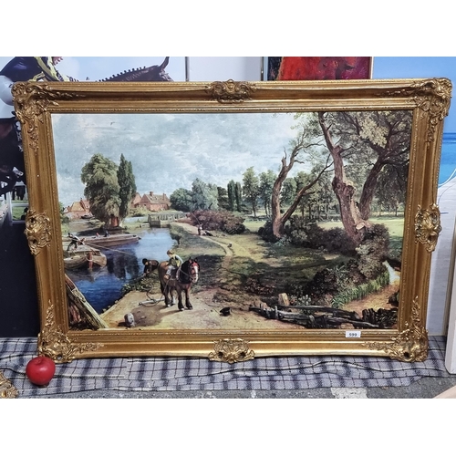 599 - A large vintage print on canvas of a John Constable painting titled 'Flatford Mill'. Housed in a hig... 