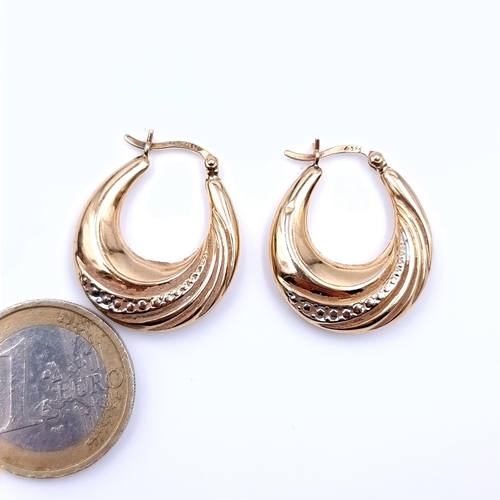 614 - A pair of 9K gold (375) hoop earrings suitable for pierced ears, total weight 2.52 grams.Boxed