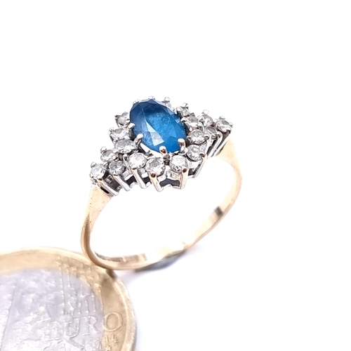 615 - An attractive diamond and central blue topaz stone ring mounted in 9K gold (375), ring size N, weigh... 