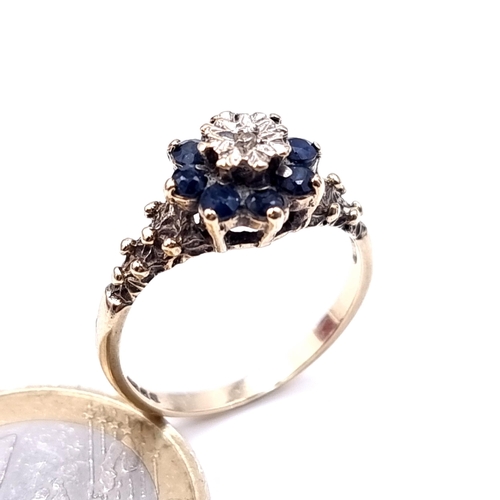 616 - Star Lot : A sapphire and illusion set diamond ring with floral mounted shoulders ring size O, weigh... 