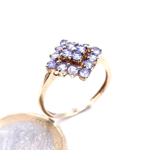 617 - Star Lot : An attractive tazanite stone cluster ring mounted in 9K gold (375), size P, weight 2.33 g... 