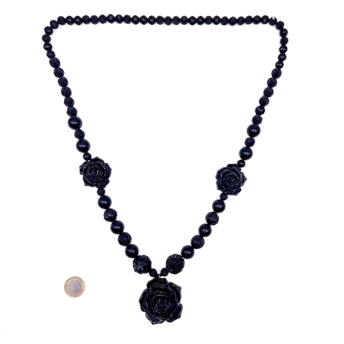 634 - An attractive example of an art deco graduated rose design Jett mourning pendant necklace, length 86... 