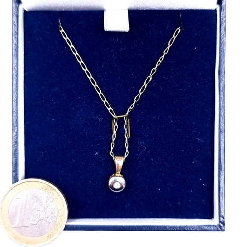 643 - Star Lot : A 9K gold diamond set pendant and chain, length of chain 44cm, weight 2.17 grams, boxed.