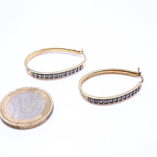 646 - A quality sterling silver  gilt diamond set hoop earrings suitable for pierced ears, total weight 4.... 