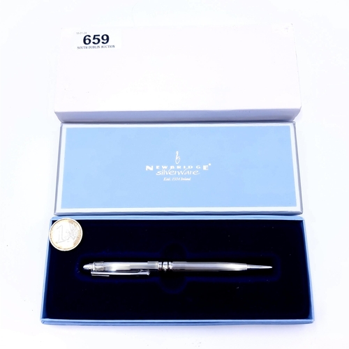 659 - A Newbridge silverware ballpoint pen in a brushed chrome finished presented in original box.