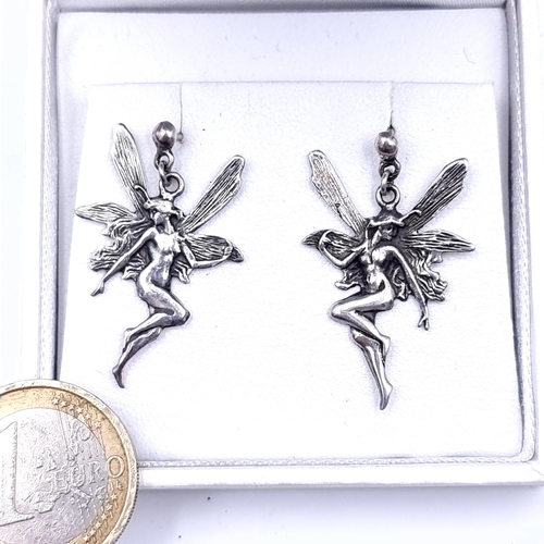 665 - A pair of sterling silver stud earrings depicting winged fairies.