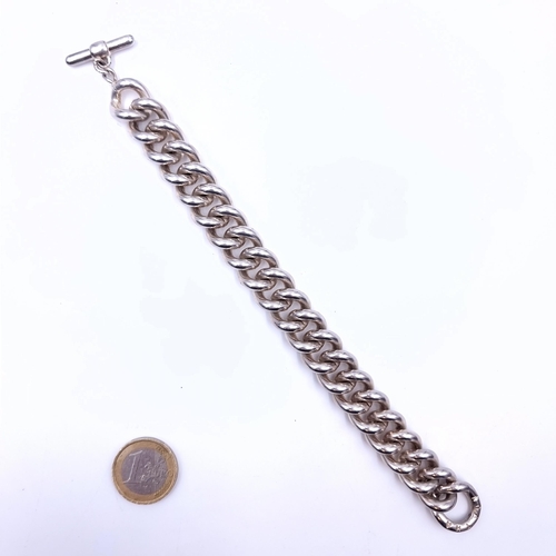 673 - A very heavy sterling silver chain link bracelet with t-bar clasp, weight 100.7 grams. Boxed.