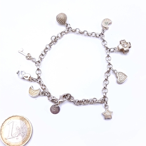 676 - A sterling silver 8 charm bracelet, weight 16.88 grams, boxed.