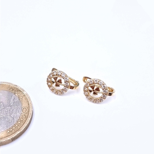 679 - A pair of 14K gold shamrock design stud earrings, total weight 1.3 grams.