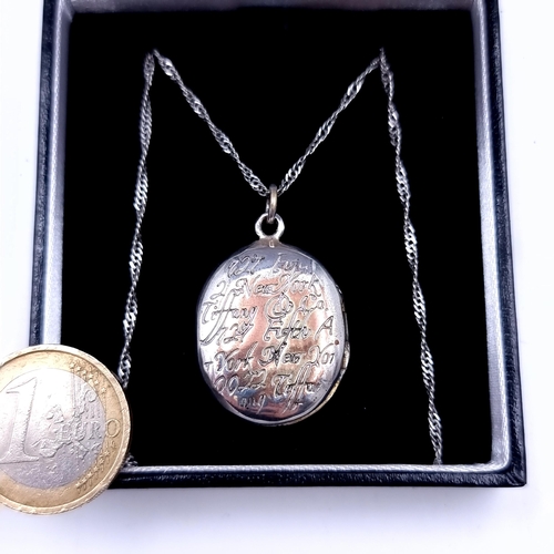 700 - A Tiffany double sided locket with Tiffany inscription to front, on reverse stamped Tiffany &co 925,... 