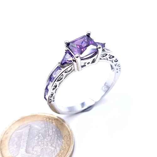 701 - An amethyst stone ring set with amethyst shoulders, mounted in sterling silver,  size V, weight 4.12... 