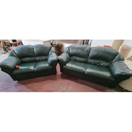 726 - A matching set of comfortable two seater sofas, upholstered in a classy forest green Italian leather... 