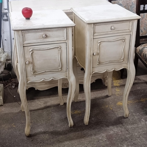 731 - Star Lot : A chic pair of side lockers with drawer to top and cupboard to base. Held on long cabriol... 