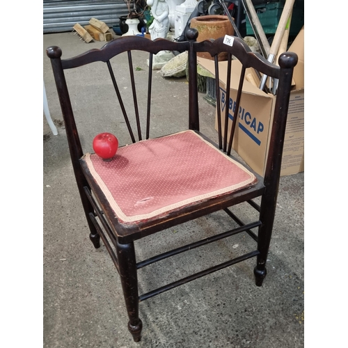 736 - A very sweet antique Edwardian corner chair with fanned spindles to back, upholstered in a red fabri... 