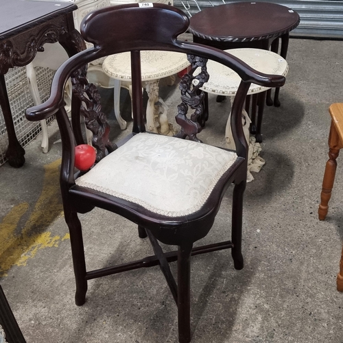 740 - A very sweet Edwardian style corner chair with fabulous carved detailing to sides in the form of a b... 