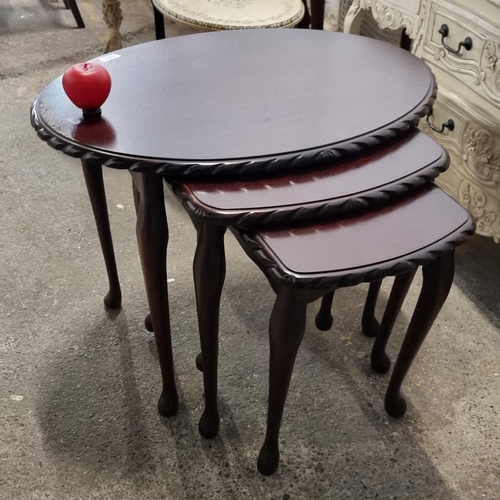 743 - A lovely set of three nesting tables with gadrooning to table rim, and all held on cabriole legs.