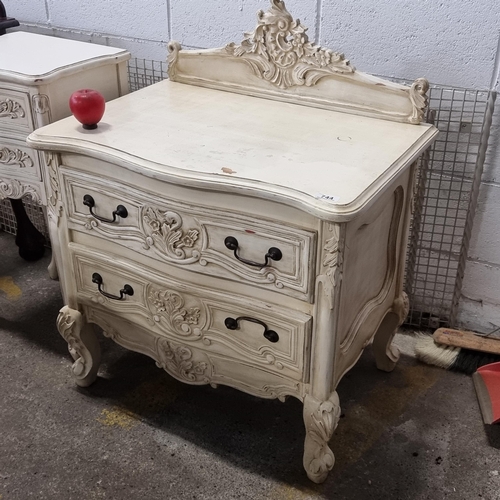 744 - A chic chest of drawers with two full length drawers. Features fabulous foliate carving throughout, ... 