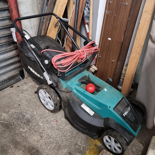 745 - A Ferrex corded electric lawn mower model GLM44 with three pin plug.