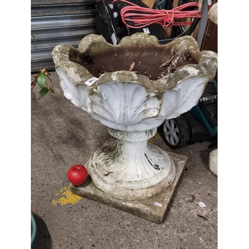 748 - A fabulous large reconstituted stone garden planter with a basin featuring a leaf motif and footed b... 