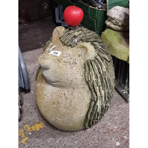 758 - A characterful large, heavy reconstituted stone garden figure in the form of a hedgehog with slate s... 