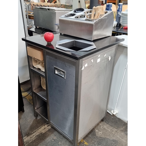 776 - Star Lot : A commercial kitchen/cafe coffee accessory dock  with a black granite top, built-in bin a... 